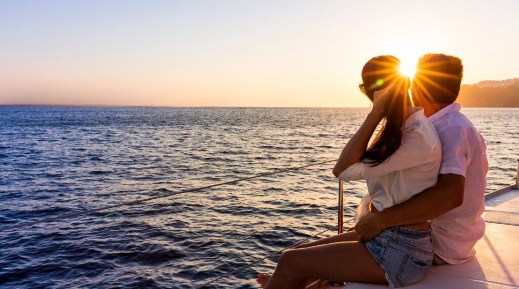 Couple on a romantic sunset catamaran cruise in Riviera Maya